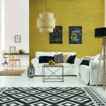 Apartment_with_white_brick_wall,_sofa,_table_and_pattern_rug